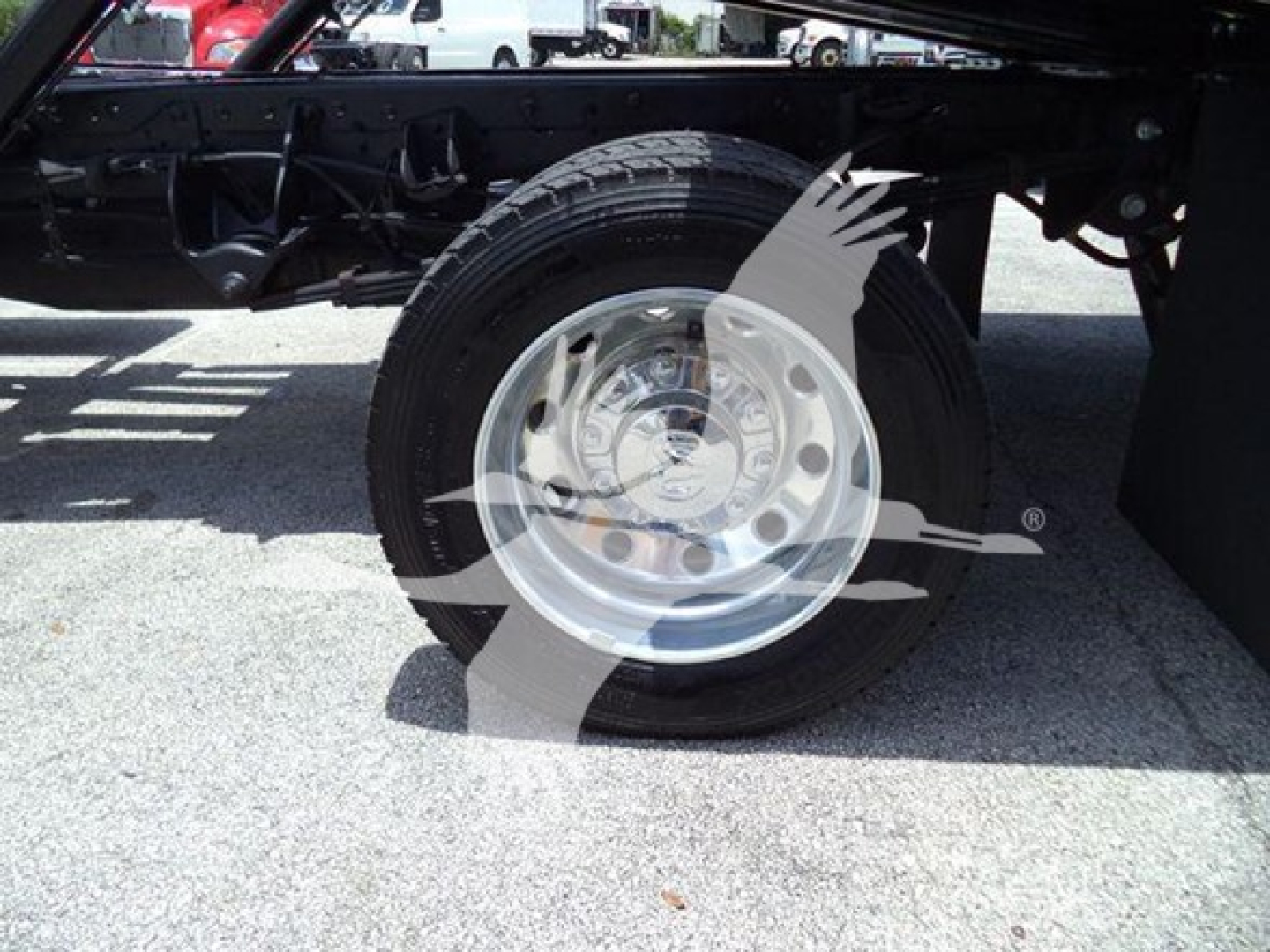 Ram 5500 truck wheel and undercarriage showing front tire and chrome hubcap.