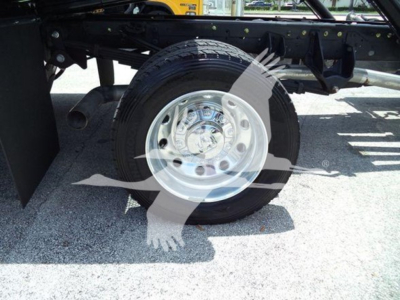 Ram 5500 rollback truck wheel and suspension showing front wheel with hub and tire.