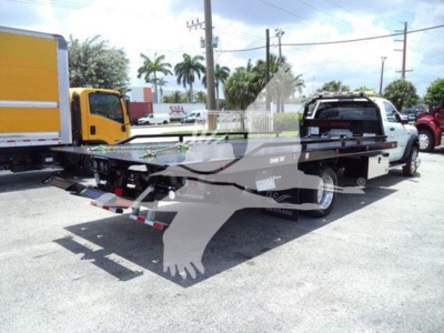 Ram 5500 SLT rollback tow truck showing flatbed and rear hitch with branding and vehicle outline overlay.