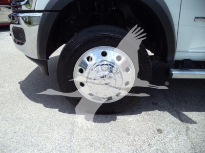 Ram 5500 truck front wheel area with chrome hubcap and black fender; overlay watermark obscures center