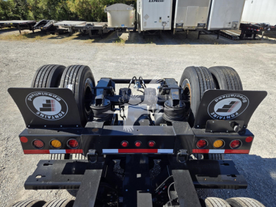 Heavy-duty Fontaine 51/60 flip axle trailer with dual rear flip ramps and dual tires, hydraulic components visible on the undercarriage.