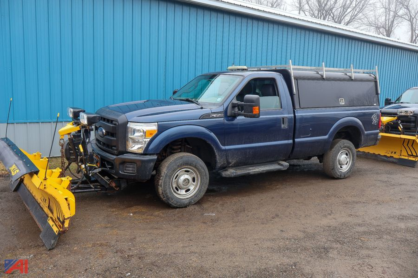 Ford F-350 Super Duty pickup with service bed and snow plow attachment in blue, side view, 4x4, single rear wheel configuration.