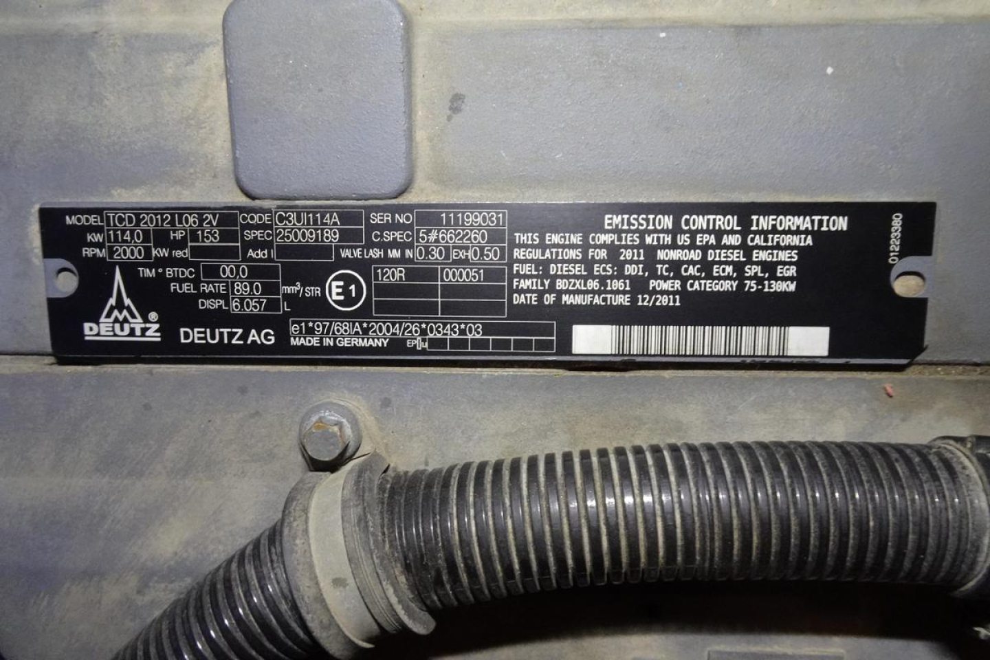 Identification plate on Terex MHL 331 showing model, VIN, and emission information along with Deutz logo; surrounding hoses and label area visible.