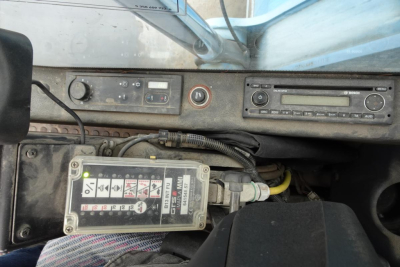 Dashboard area of a 2012 Terex MHL 331 with control panel, gauges, and a labeled control box showing icons and wiring.