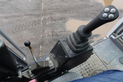 Trucking equipment control console with joystick and lever in operator cab of Terex MHL 331.