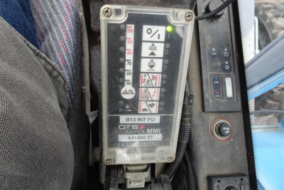 Terex MHL 331 control panel with percentage gauge and warning icons visible.