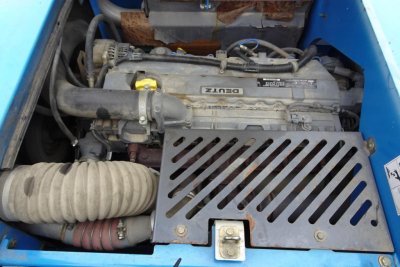 Diesel engine bay of Terex MHL 331 showing Deutz engine with air intake hoses and radiator guard.