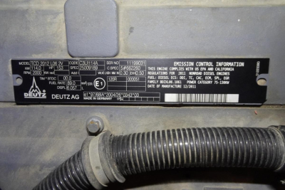 Identification plate on Terex MHL 331 showing model, VIN, and emission information along with Deutz logo; surrounding hoses and label area visible.