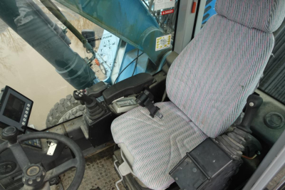 Cab interior of 2012 Terex MHL 331 showing operator seat, joystick controls, steering wheel, and display panel.