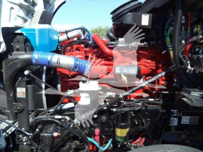 Kenworth T880 engine bay showing Cummins X15 engine and surrounding components.