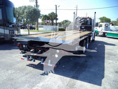 Kenworth T880 rollback truck flatbed showing rear and side view with hitch and taillights