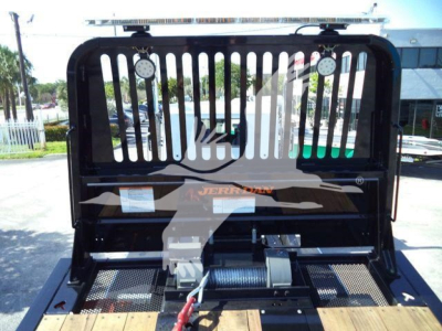 Kenworth T880 rollback truck front grille and winch area shown, with heavy-duty steel grille, winch line, and mounting hardware visible.