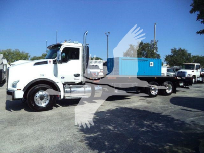 Kenworth T880 rollback truck with flatbed and blue container, side view