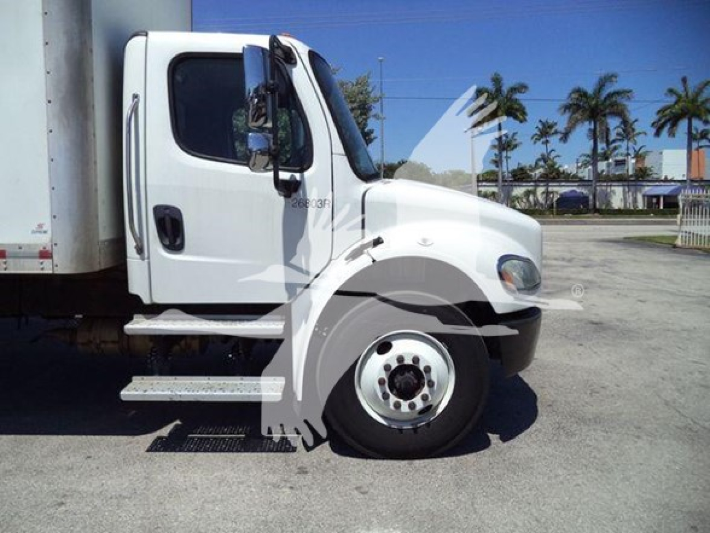 Freightliner M2 106 cab side profile showing front wheel and door with step.