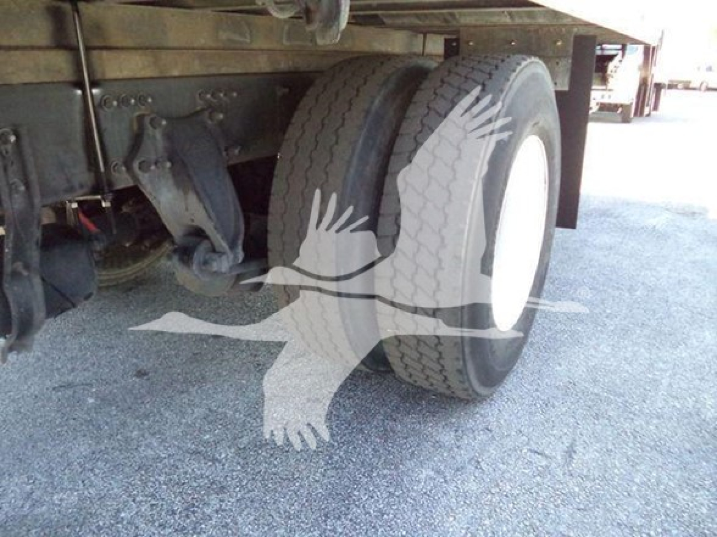 Dual rear wheels on a Freightliner M2 106 truck showing chassis and tires