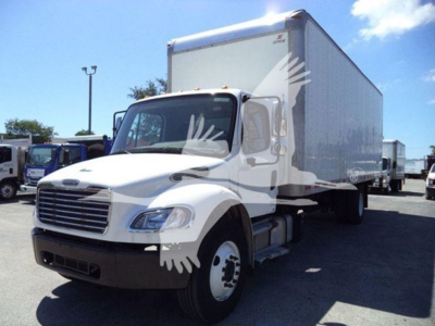 Box truck with a white cab and large box cargo area; Freightliner M2 106 chassis visible from front-left angle.