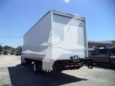 Box truck rear and side view showing Freightliner M2 106 with a white box body and black undercarriage.