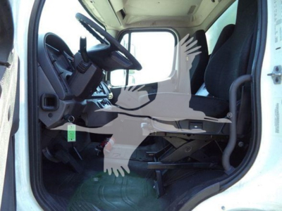 Cab interior of 2018 Freightliner M2 106 truck showing driver seat, steering wheel, and dashboard area