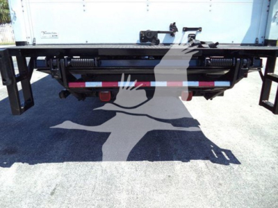 Rear view of 2018 Freightliner M2 106 truck showing hitch, hydraulic lines, and bumper structure with reflective tape.