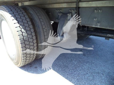 Freightliner M2 106 undercarriage showing dual rear wheels and suspension components.