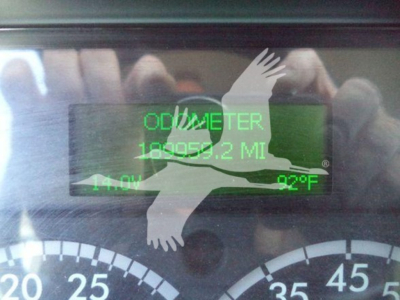 Gauge cluster with digital readout showing ODOMETER 189059.2 MI, 14.0V, 92°F on Freightliner M2 106 dash display.