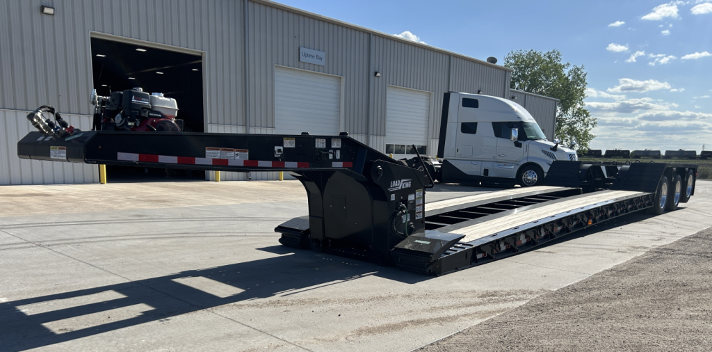 Load King 503/554 SS SF lowboy trailer with 8'-6" deck showing hydraulic winch and extended gooseneck.
