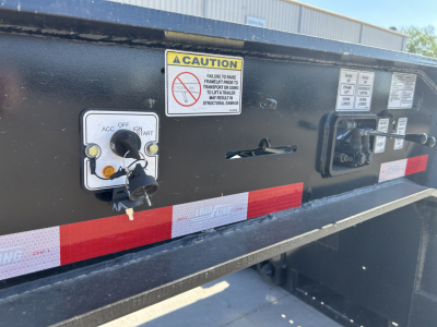 Trailer control panel with ignition switch and caution label on Load King 503/554 SS SF lowboy trailer.