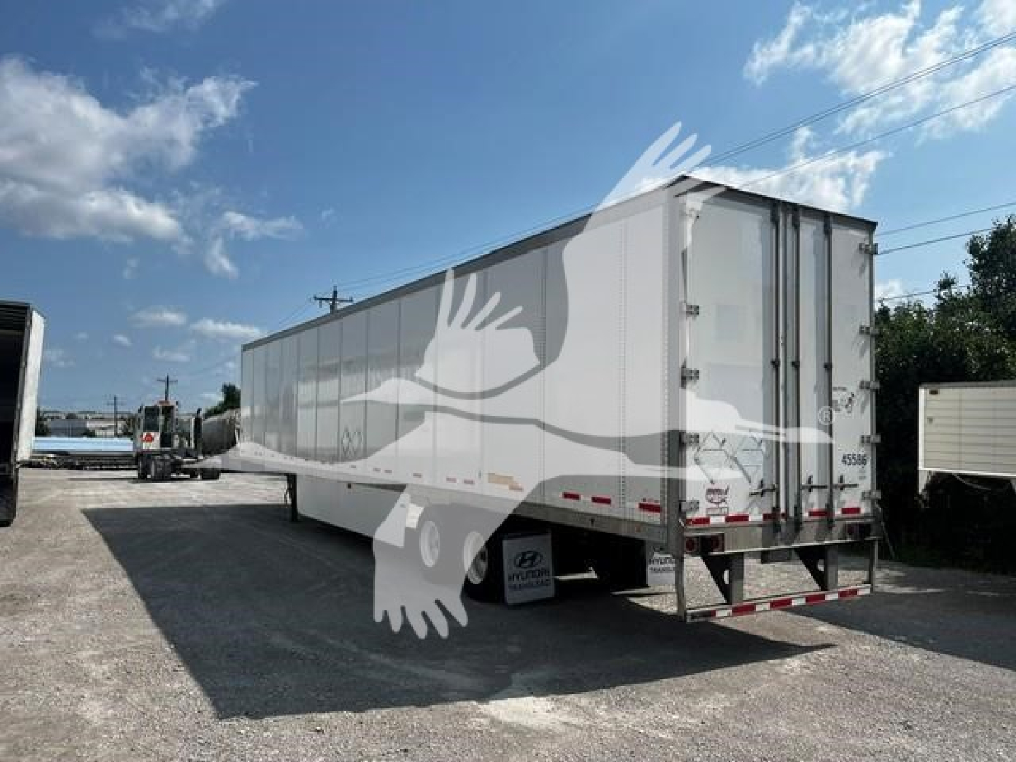 Trailer side and rear of a used 2017 Wabash van trailer showing its long rectangular body, rear doors, bumper, and wheel wells. Visible text includes generic trailer features but no legible brand or model text.