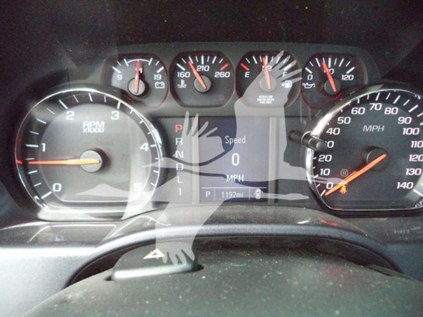 Dashboard of a 2023 International CV rollback truck showing various gauges and digital display with vehicle speed 0 mph. Visible labels include RPM 0-6k, MPH 0-140, gear indicator P R N D L, and small gauges on top.