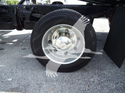 Truck wheel and dual rear axle area showing steel rim and tire underframe components.