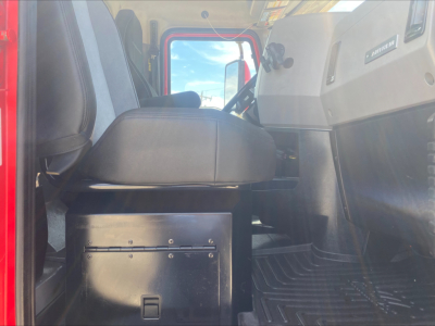 Interior of a 2021 Mack Anthem truck cab showing driver seat and dashboard area with center console and gear area.