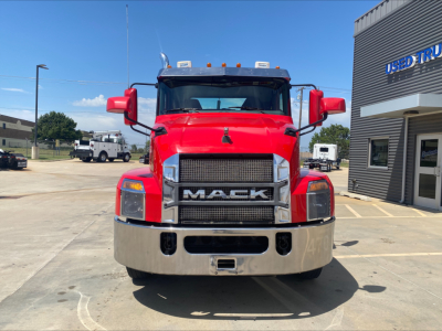 Front view of a red 2021 Mack Anthem truck with large grille, chrome bumper, and Mack logo; visible text on grille and surroundings.