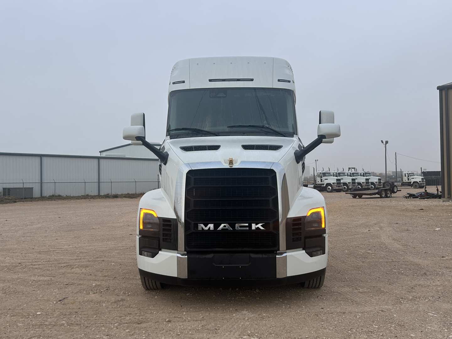 Mack PR64T44 truck front view showing bold grille and headlights.