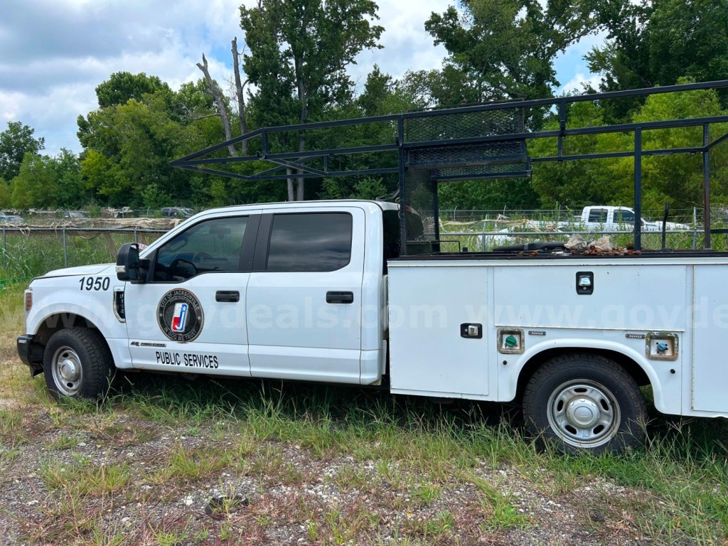 Ford F-350 service/utility truck side view showing utility racks and compartments