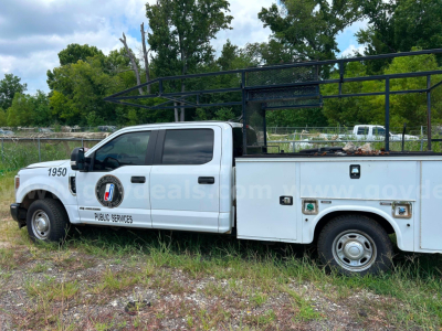 Ford F-350 service/utility truck side view showing utility racks and compartments