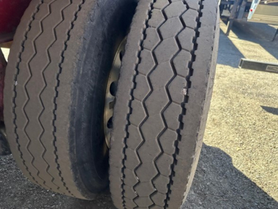 Great Dane spread air combo flatbed trailer wheel set showing dual tires with tread pattern.