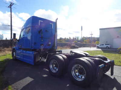 Mack PR64T64 tractor truck cab and rear chassis with dual rear axles and chrome wheels.