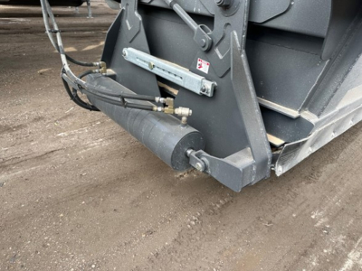 Bottom dump trailer hydraulic cylinder and connection hose assembly showing hydraulic line and frame fixture