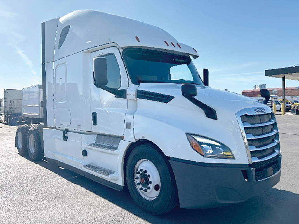 Truck cab in white with aerodynamic sleeper, Freightliner Cascadia 126 model, front grille, large side mirrors, daytime run, no text visible