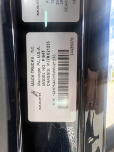 Mack Trucks label on a truck showing VIN 1MP? not sure. Visible text includes 'MACK TRUCKS INC.', 'MADE IN USA', 'MACK TRUCKS, INC.', 'MAC...', 'CHASSIS NO: M...'
