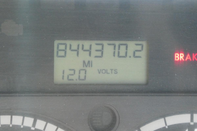 Dashboard display showing 12.0 Volts and mileage 844370.2 miles on Freightliner Cascadia 113 truck.