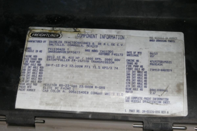 Truck component information plate showing Freightliner branding and various specs including VIN 3AKBGADV2ESFP0877, stock 0421232, model CASCADIA 113, and production data.