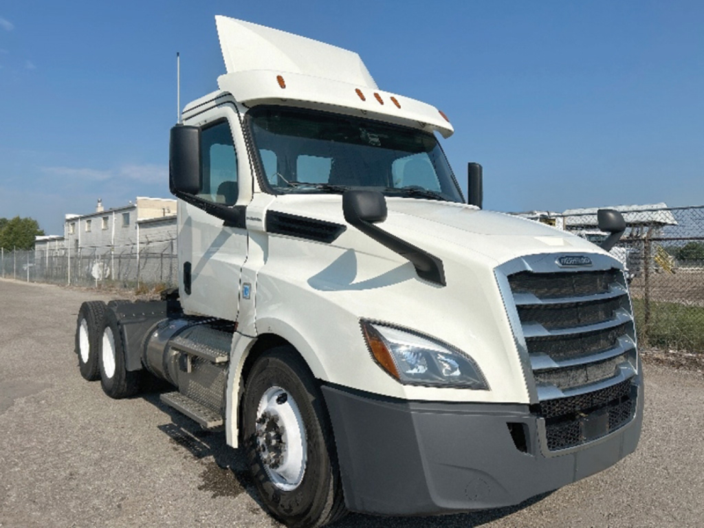 Truck: 2019 Freightliner Cascadia126 conventional daycab showing front grille, headlights, and side mirrors.