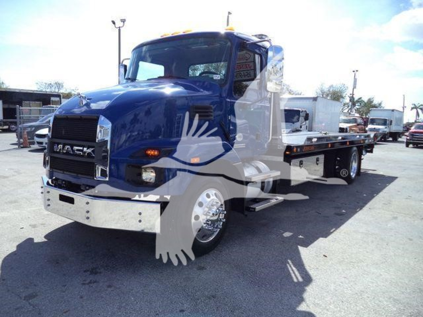 Truck shows a 2027 Mack MD6 rollback w/ flatbed. Front grille displays MACK, chrome bumper, dual headlights, and side mirrors. Stock number J13239 visible.