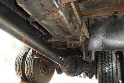 Freightliner M2-106 underside showing driveline and frame components.