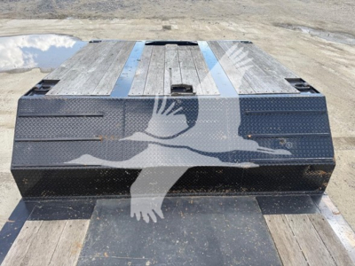 Trailer deck showing dual-drop expandable trailer with wooden deck and metal end walls, black frame, watermarked with overlapping eagle graphic.