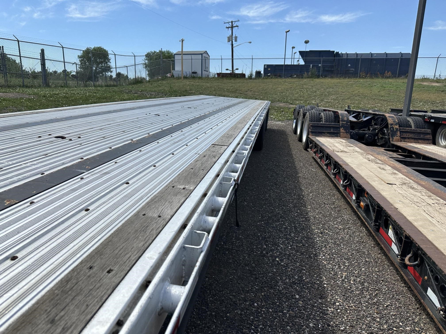 Great Dane combo spread air drop deck trailer showing aluminum decking with rollers and a flatbed section; no visible text legible on the deck in this shot.