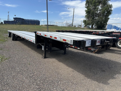 Great Dane combo spread air drop deck trailer showing long low-profile flatbed with red-and-white reflective strips and black undercarriage, tag 202 on tail, VIN 150120756250.