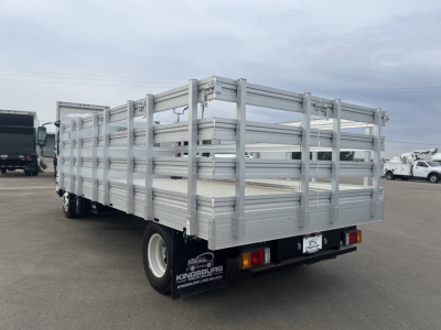 Chevrolet 4500 HD flatbed truck rear view showing aluminum stake bed with side rails and dual rear tires.