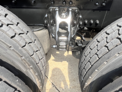 Kenworth T680 chassis center showing fifth wheel hitch and dual rear tires.